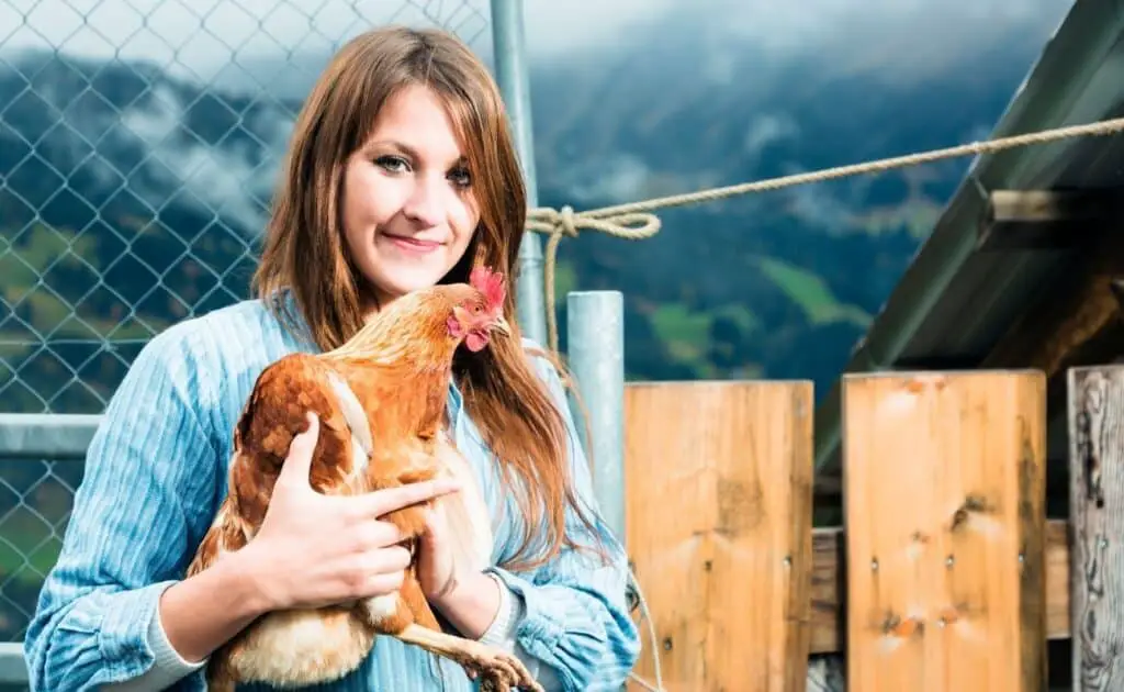 women holding a chicken