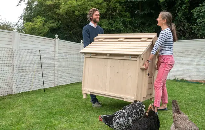 moving a wooden chicken coop